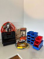 Group shot of jigsaw, cords, storage bins, Guidemate box