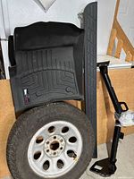 Wheel, tire, mat, tailgate cover, hitch together