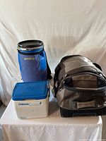 All three items: Trailhead barrel, Coleman cooler, tent in duffel