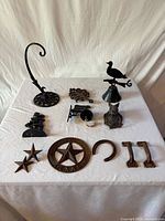 All cast metal pieces laid out on table