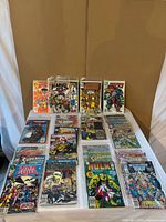 Overview of 25 bagged comic books on table