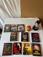 All DVDs, coin bank and Star Wars gumball machine arranged on table