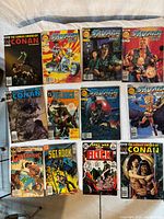 All 12 comics laid out in three rows for full lot overview