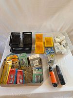 overview of lot showing bins, drivers, hardware packages and PVC fittings