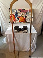 Two wooden sticks (Sher-Wood, Cooper), tabletop hockey game box, pair of boxing gloves