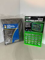 Overall view of sealed tarp and boxed wire terminal assortment