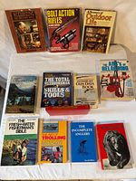 All twelve books arranged on table, titles visible