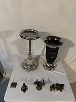 Full lot showing both stand ashtrays and small cast items