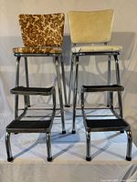 Front view of both chrome step stools showing seats, backs, and steps