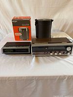 Overall lot: two radios and Tiger lunch jar with box