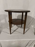 Finished two-tier table showing design and condition