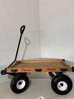 Full view of wooden Express Wagon with handle and four pneumatic tires