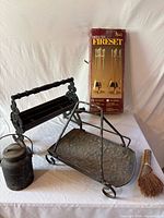 All items group shot: boxed fireset, log holders, oil can, broom