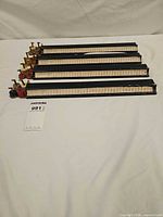 Four racks laid out showing overall condition and size reference tag 991