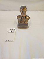 Front view of brass Abraham Lincoln bust