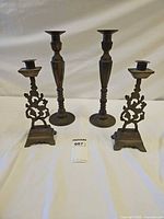 All four candlesticks front and back view