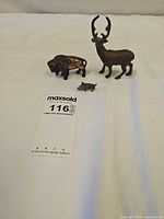 Front view of all three metal animal figurines