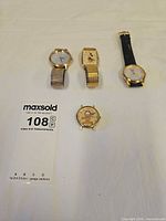 Front view of all four watches showing dials and character graphics