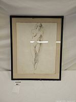 Front view of framed charcoal sketch