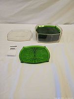Stack of trays plus single tray front, shows size and design