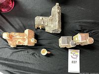 Overview of assorted ceramic houses and small mug