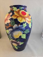 Full front view of Maling cobalt blue vase showing embossed floral design