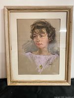 Full view of framed pastel portrait