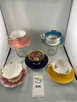 Group shot of the five teacup and saucer sets