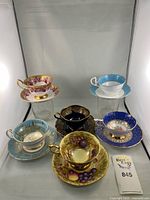 Group shot of six teacup and saucer sets