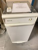 Front view of Jenn-Air trash compactor showing control panel and overall condition