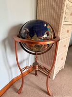 Full view of globe on stand showing color and structure