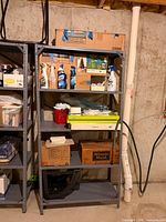 Left shelving unit close-up showing adjustable shelves and steel frame