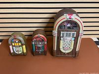 Front view of all three jukebox units side-by-side