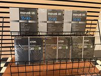Front view of all six tape boxes on rack
