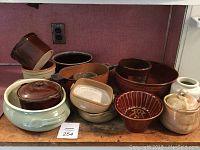 Full lot of 13 kitchen pottery items including crocks, aspic mold, and Bennington piece