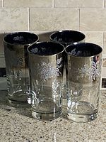 Four highball glasses upright showing exterior design
