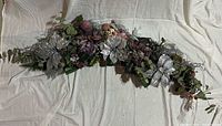 Full view of 4 ft decorated garland laid flat