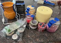 overview of warmers, candles, wax melts on countertop