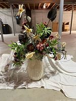 Full view of arrangement in white ceramic vase