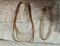 Both necklaces side by side showing overall design and bead detailing