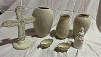 All seven ivory porcelain items grouped