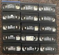 All 15 VHS tapes laid out, labels visible
