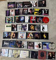 Overhead view of entire lot showing rows of CDs and two loose discs