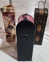Three wine boxes side by side showing overall styles and condition