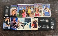 All fourteen VHS tapes displayed front and spines