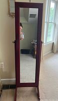 Front view closed showing full-length mirror and stand