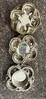 Three ornate round mirrors with distressed brass/bronze finish frames