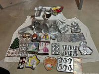 Group shot of all Wilton pans arranged on cloth