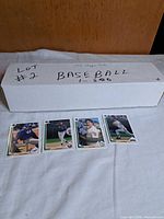 Long white storage box labeled Lot #2 Baseball 1-800 with four sample card fronts displayed
