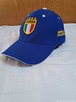 Front angled view showing Italia patch, embroidery, brim